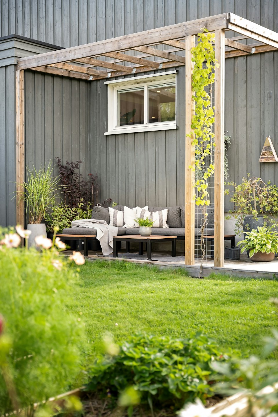 Spacious timber deck with comfortable seating area and decking rails.