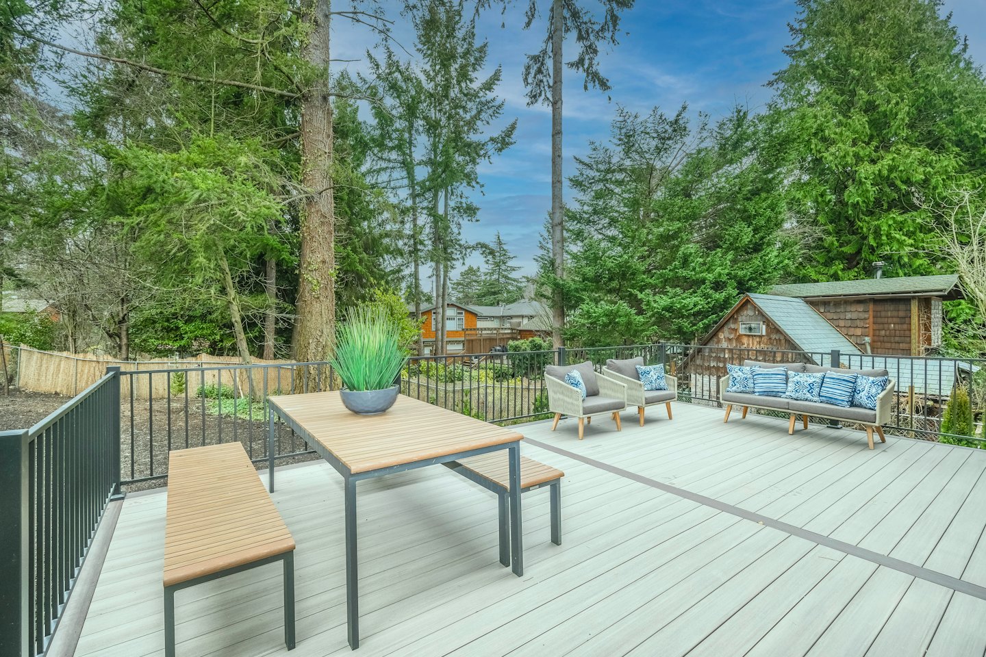 Custom composite decking installation with stylish outdoor seating.